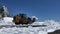 Tractor with snowplow clears to Rim Drive road at Crater Lake