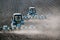 Tractor with sower on the field