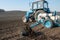 Tractor with sower on the field