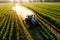 Tractor spray fertilizer on green field drone high angle view, agriculture background concept. Generated AI