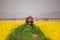 Tractor spray fertilizer spraying pesticides on rapeseed field, agriculture background concept