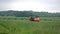 Tractor and Sprayer on Wheat Field