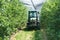 Tractor spraying greenhouse