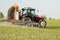 Tractor spraying soybean crops field