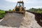 Tractor Spreading Marl On New Road In Jamaica