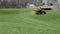 Tractor Spreads Seed Over City Lawn