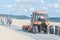 Tractor is sweeping alley along coast of Baltic Sea