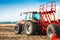 Tractor with tanks in the field. Agricultural machinery and farming.