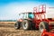 Tractor with tanks in the field. Agricultural machinery and farming.