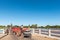 Tractor, trailer with grape pickers, crates crossing Orange River, Marchand