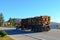 Tractor trailer truck hauling logs