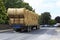 Tractor transporting straw bales in irish