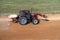 the tractor treats the chemistry of the autocross tracks before the races