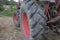 Tractor wheel in a farmland close up, agriculture concept