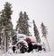 Tractor in winter forest