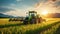 Tractor working on the rice fields barley farm at sunset time, modern agricultural transport