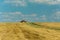 Tractors driving across the stubble field