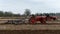 Tractors Plough a Field