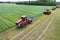 Tractors with plow on soil cultivating. tractor bowling field, drone view. Cultivated plant soil tillage. Agricultural