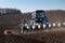 Tractors with sowers on the field