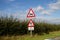 Tractors Turning and Windy Road for 500 Yards Sign