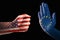 Trade conflict, fist with USA flag against a hand with European