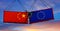 Trade war. Two freight containers with European Union  and China flag crashing into eachother. 3D Rendering