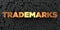 Trademarks - Gold text on black background - 3D rendered royalty free stock picture