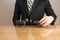 Trader sitting in front of wooden desk