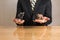 Trader sitting in front of wooden desk