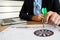 Trader woman holding a darts aiming at the target center of dart board, Setting challenging trading  goals And ready to achieve