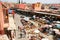 Traders selling goods under sun umbrellas