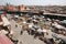 Traders selling goods under sun umbrellas