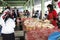 traders selling raw chicken meat at the market