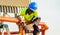 Tradesman working with an angle grinder on a building site