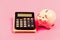 Trading exchange. Trade market. Finance control. Credit concept. Calculate profit. Piggy bank pink pig and calculator