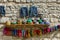 Tradional Azerbaijani souveniers hats and knitted clothing sold in Huseynov street, view on cobblestone, the main street of Lahic