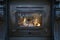 Tradional black Wood Burning Stove close-up with fire flames, antique design cozy