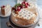 Tradional Russian cake Medovik, honey layered cake with hazelnuts and berries
