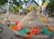 Tradition of carrying sand into the temple or monastery. Prayer flags on sand in Songkran day festival at Thailand