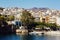 Tradition greek buildings, lake Voulismeni with boats in the center of the coastal town Agios Nikolaos