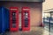 Tradition red telephone boxes.