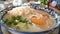 Tradition rice porridge on the table served with dough stick and boiled egg.