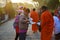 Tradition thai of almsgiving thai monks procession walk on the street for thai people respect praying and put food offerings in