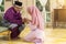Traditional act of respect in Muslim family on Eid al-Fitr