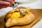 Traditional Adjara khachapuri. In a boat of dough baked cheese,