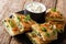 Traditional afghan friedflat bread bolani with potatoes, green onions and cilantro closeup. horizontal