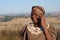 Traditional African Zulu woman speaking on mobile phone