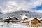 Traditional Alpine Houses Covered in Snow