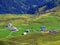 Traditional alpine livestock settlement Tannalp next to Lake Tannensee and in the Uri Alps massif, Melchtal - Canton of Obwald